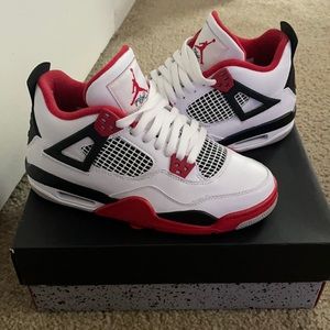 Fire red Jordan 4s.